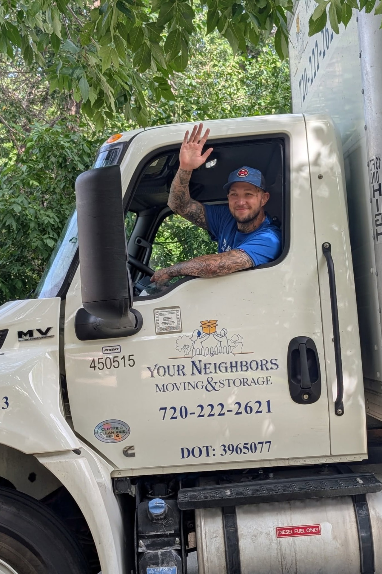 Your Neighbors mover waving from the moving truck